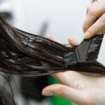 Applying hair care products in a beauty salon 2023 11 27 05 28 37 utc